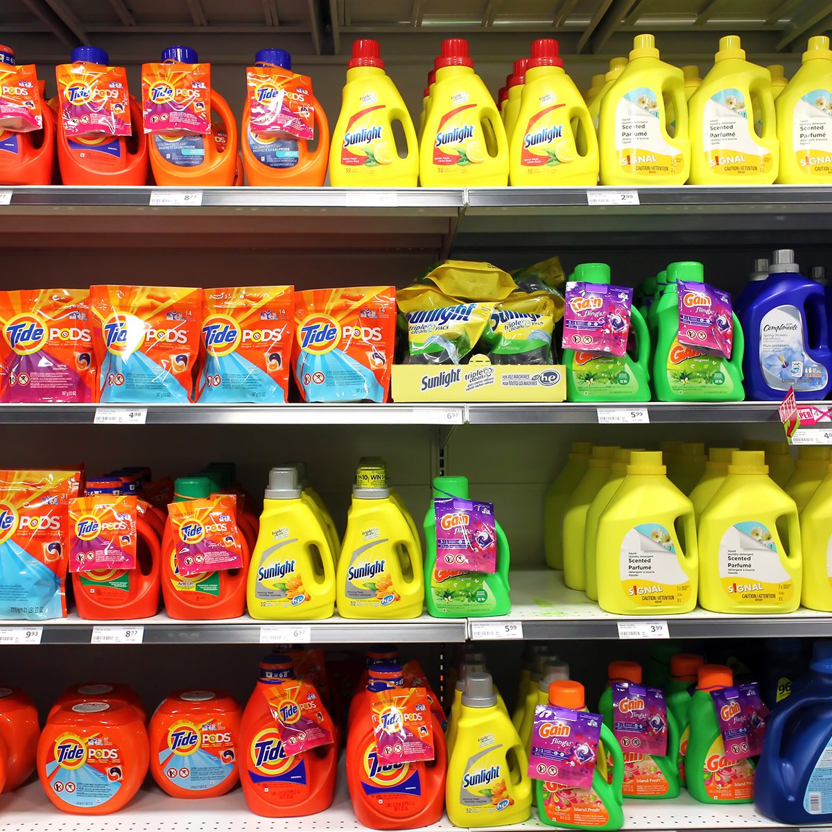 TORONTO, CANADA - MAY 06, 2014: Different types of detergents on shelves in a supermarket. Tide is a laundry detergent manufactured by Procter & Gamble and one of the top three brands of detergents.; Shutterstock ID 230120146