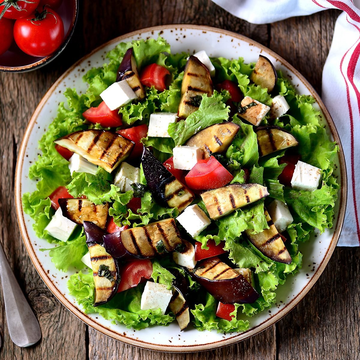 Grilled eggplant salad, tomatoes, feta and lettuce with olive oil and red balsamic, sea salt and pink pepper.