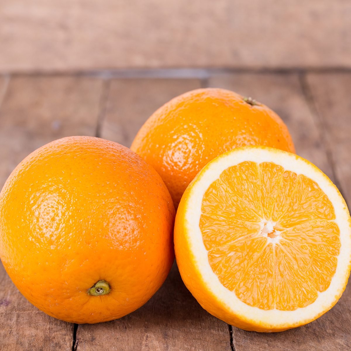 fresh, juicy, orange on a wooden background