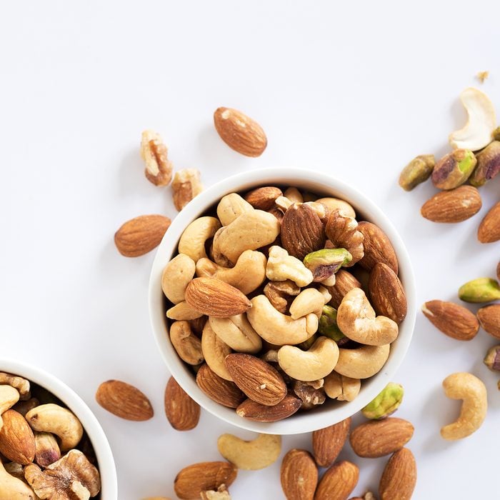 mixed nuts in white ceramic bowl