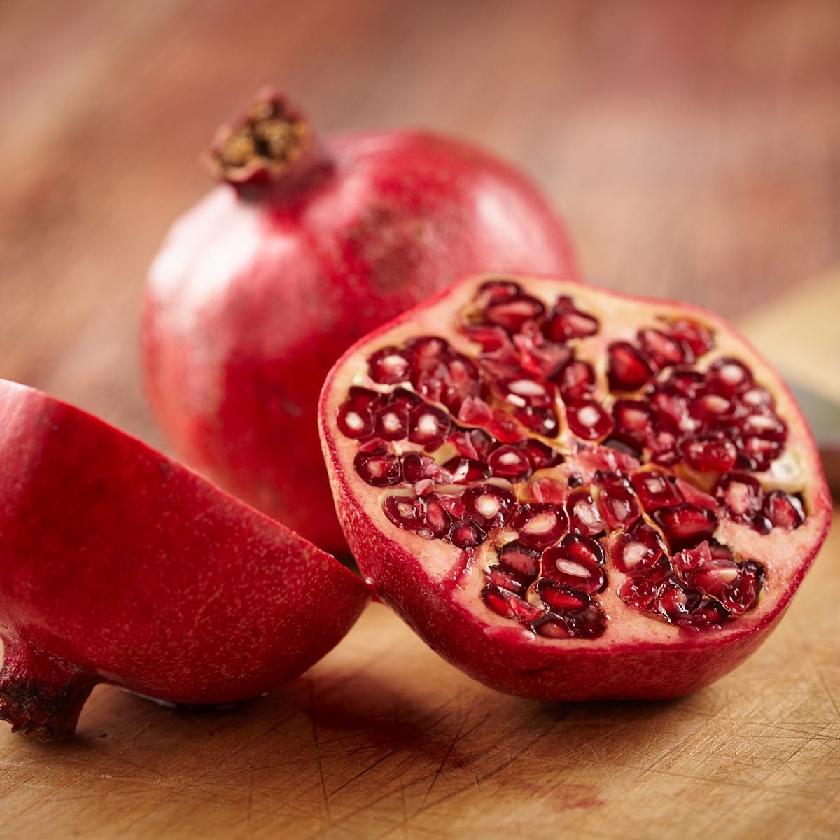 Pomegranate Fruit On Cut Board