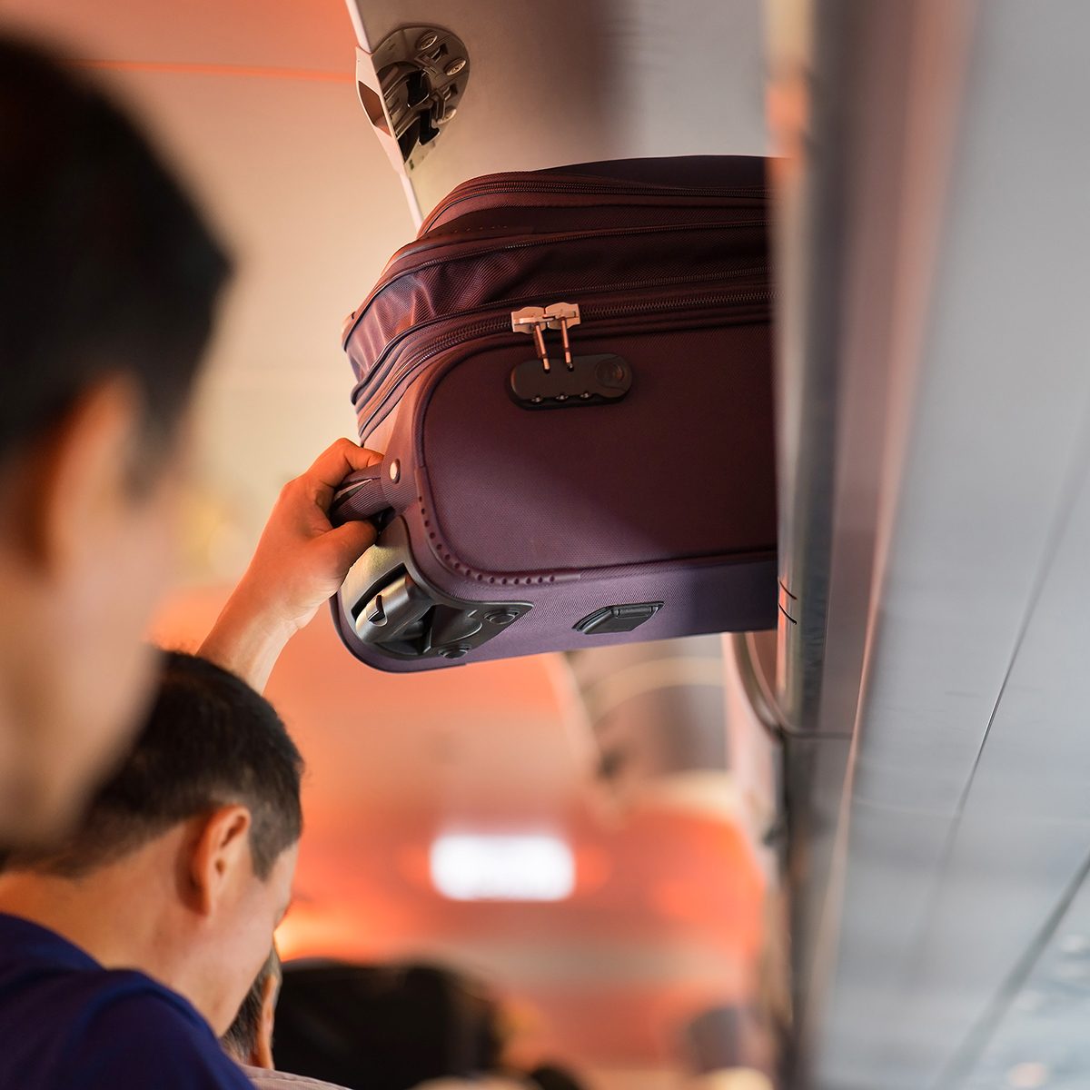 Baggage is pulling out of cabin on airplane ; Shutterstock ID 534992344