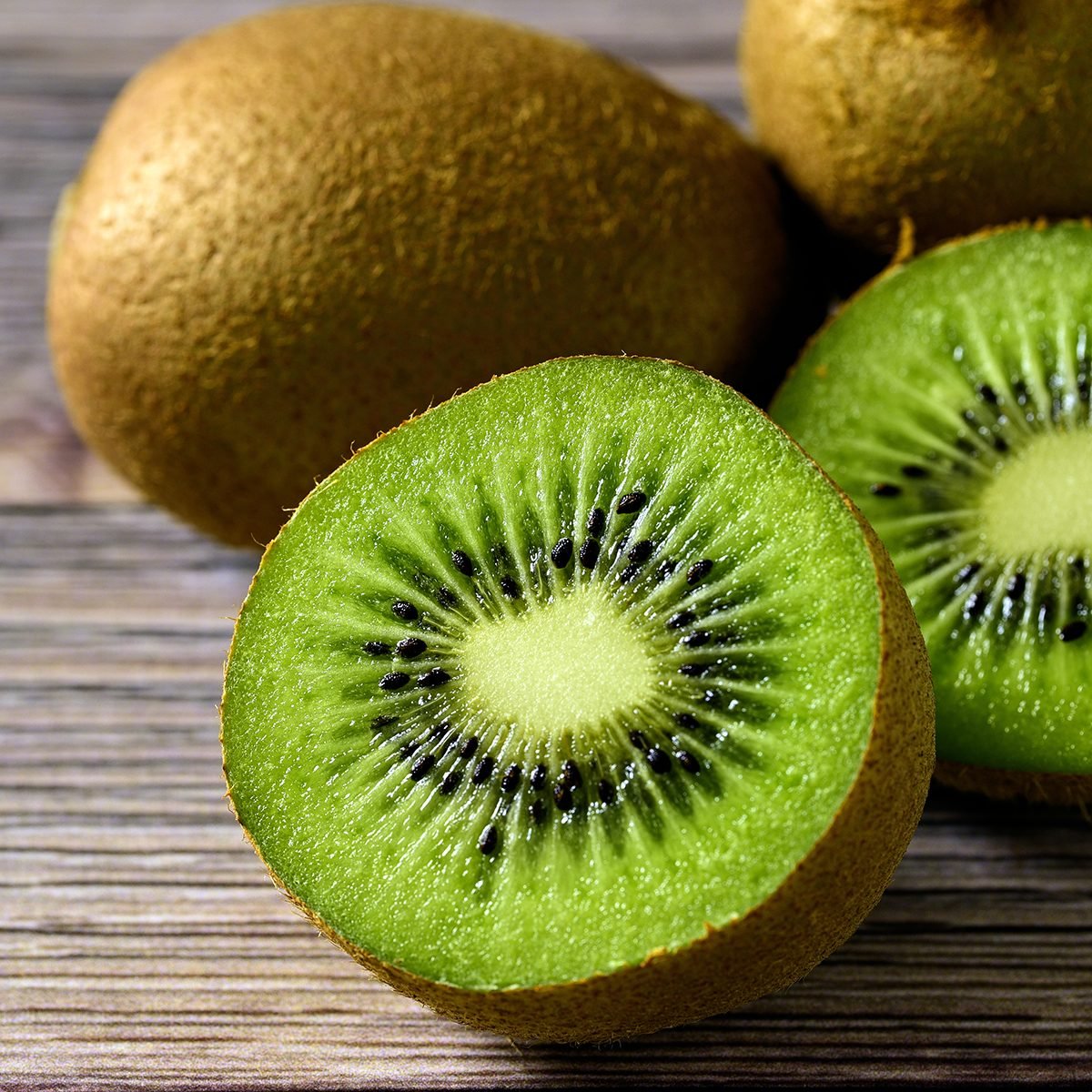 fruits for diabetics Sliced fresh kiwi fruit on wood table