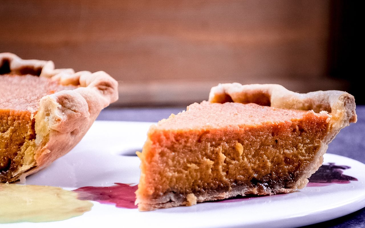 Sweet potato pie with slice cut out