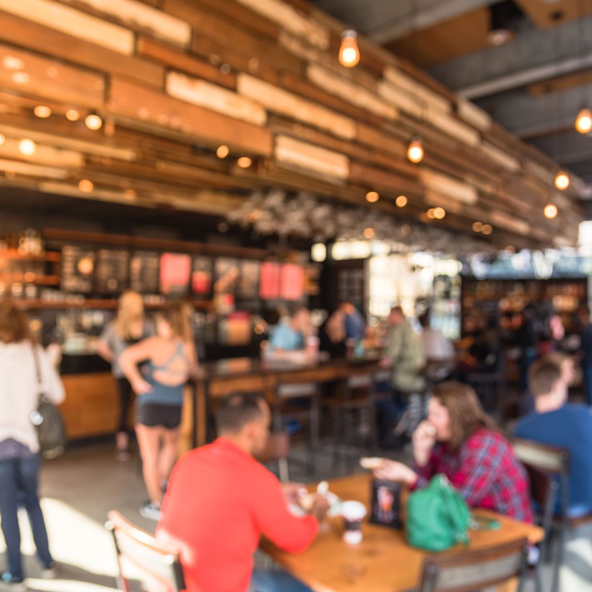 Blurred abstract coffee shop or cafe restaurant in sunny fall morning at Dallas, Texas, US.