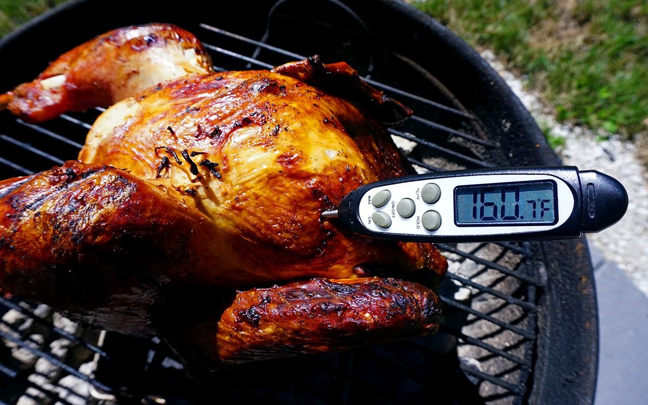 removing the turkey from the grill when the breast reaches 160 degrees