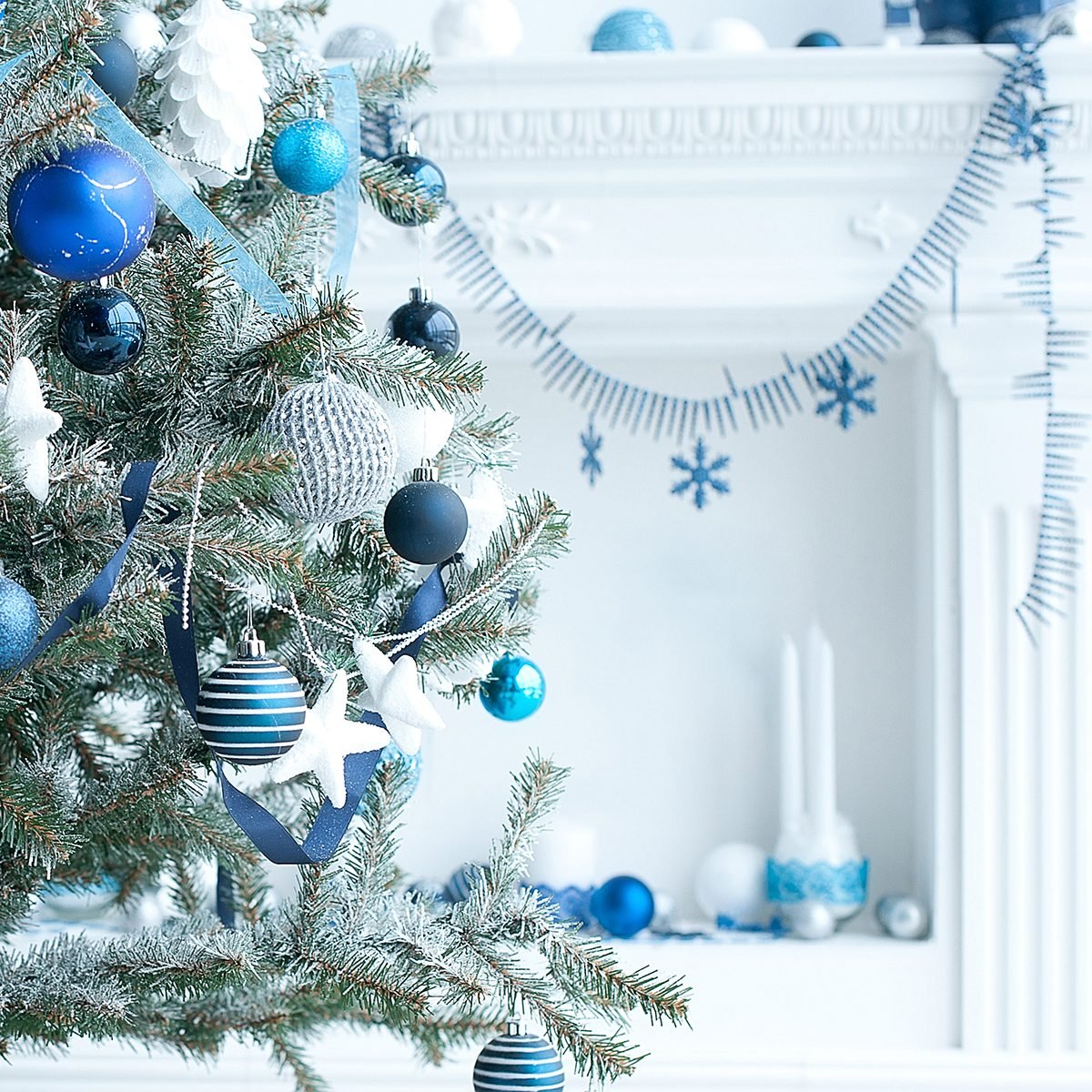 Christmas tree with blue and white toys in the interior