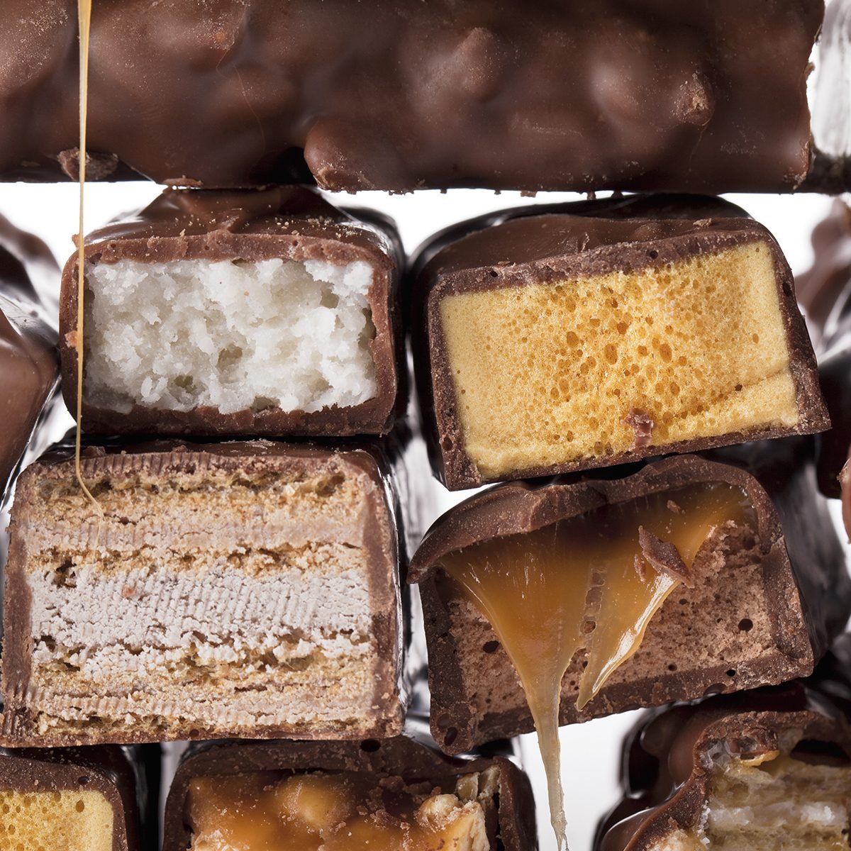 Close-up bunch of chocolate bars isolated over the white background