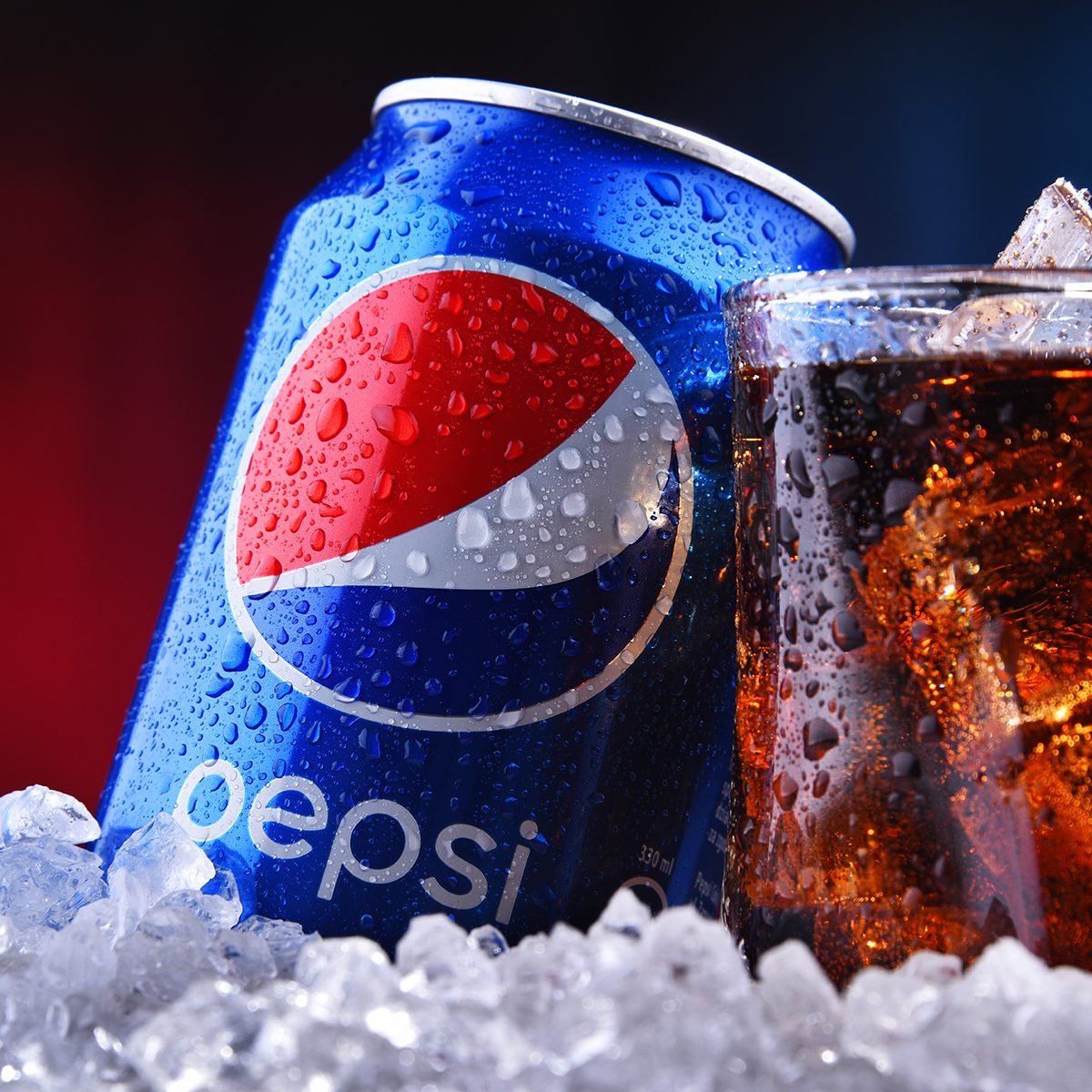 A can and a glass of Pepsi, a carbonated soft drink produced and manufactured by PepsiCo.