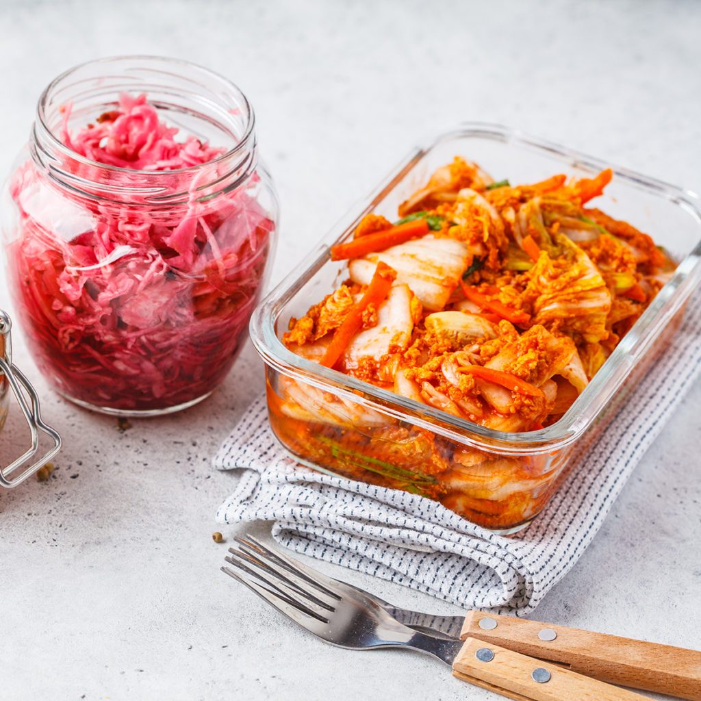 Korean kimchi cabbage, beet sauerkraut and sauerkraut in glass jars, white background. Probiotics food concept.; Shutterstock ID 1315266911; Job (TFH, TOH, RD, BNB, CWM, CM): Taste of Home