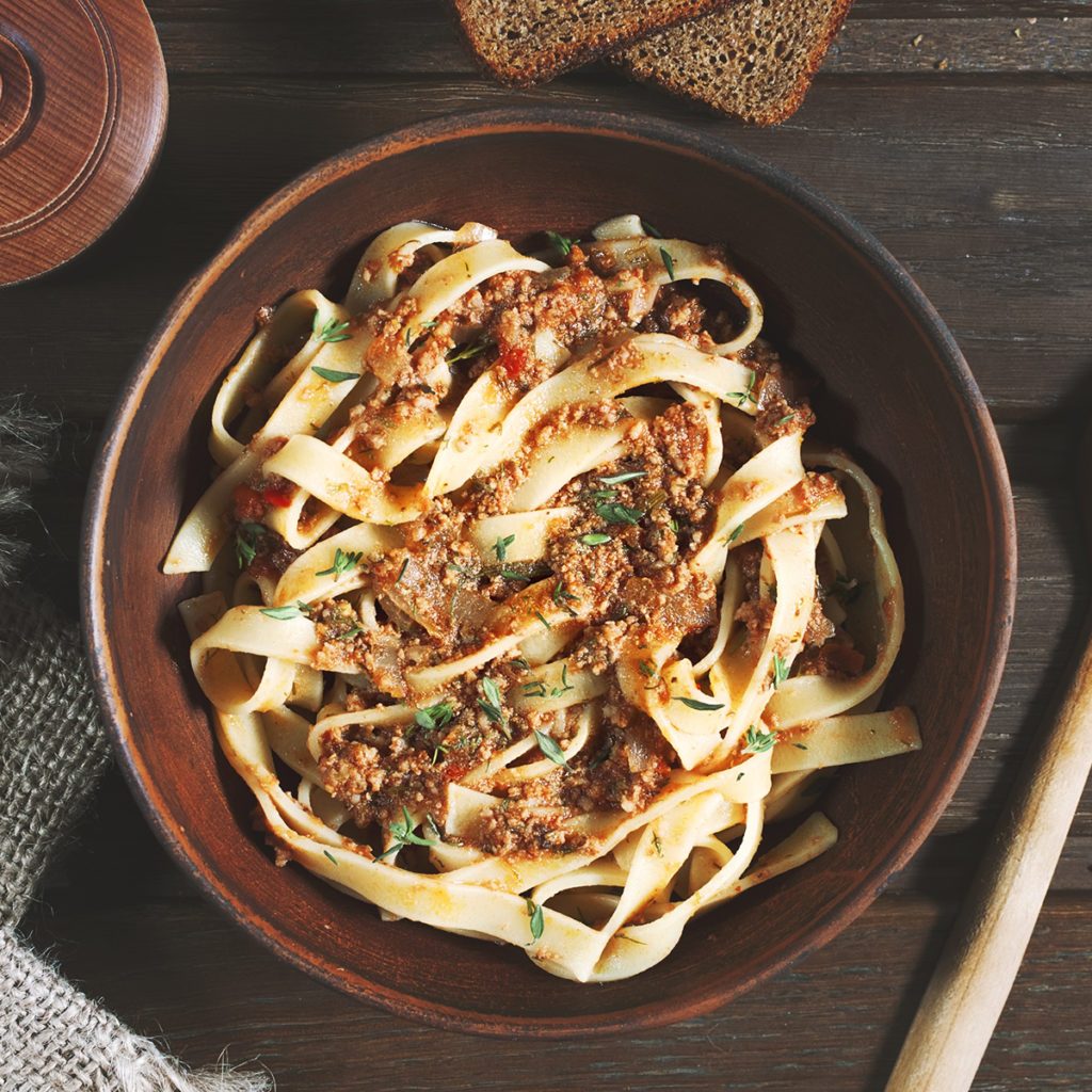 pasta tagliatelle bolognese on the wooden table, rustic style; Shutterstock ID 428277280; Job (TFH, TOH, RD, BNB, CWM, CM): Taste of Home