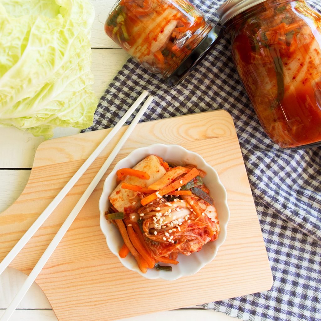 Kimchi,fermented cabbage traditional Korean food in top view on wooden table.; Shutterstock ID 750038686; Job (TFH, TOH, RD, BNB, CWM, CM): Taste of Home