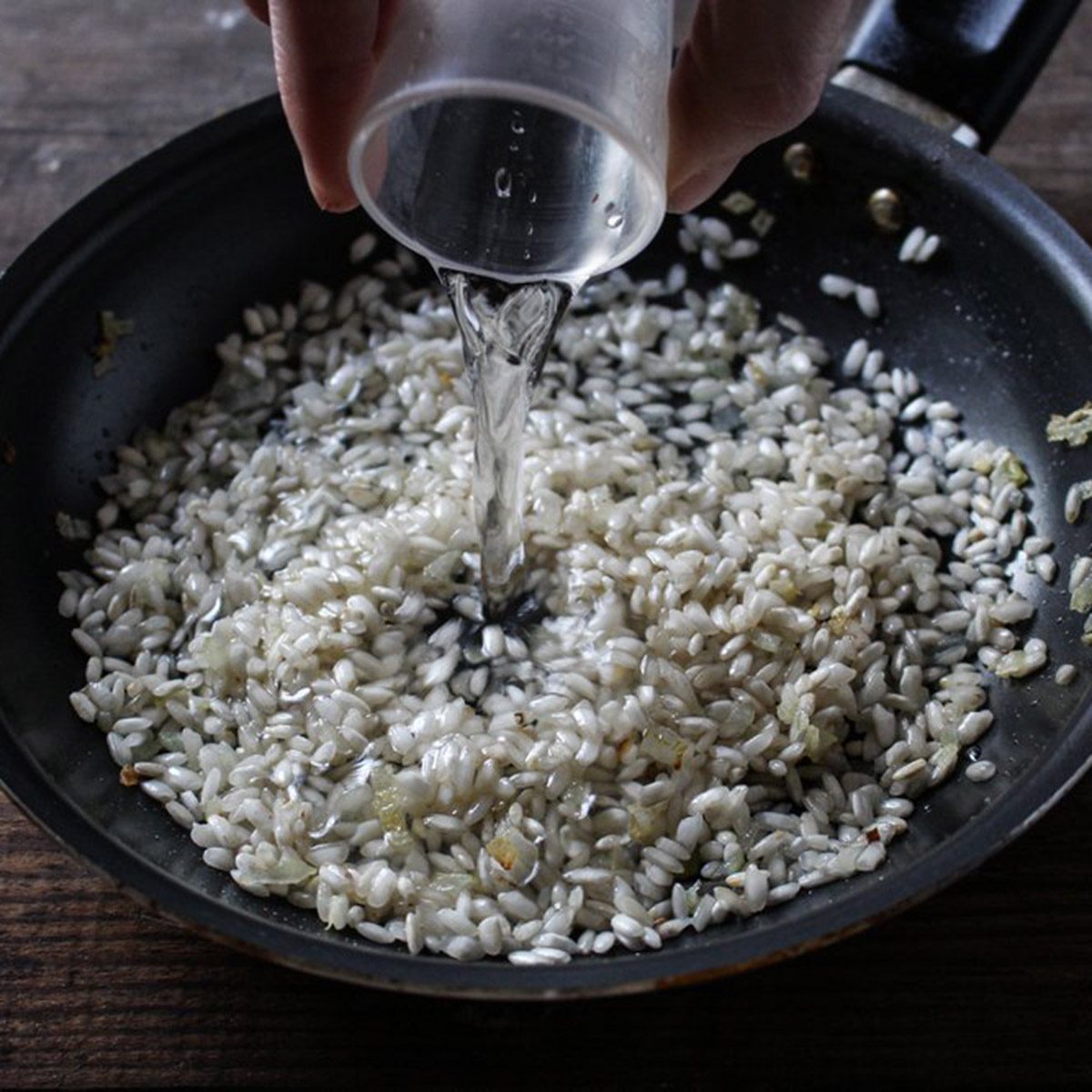 Adding water to rice