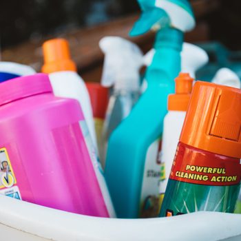 A basket full of cleaning products with the words powerful cleaning action on show