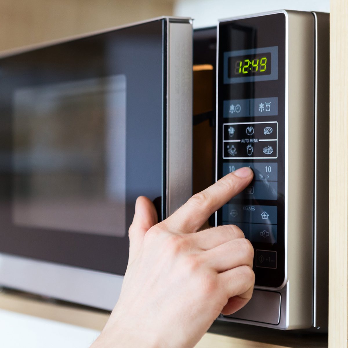 Pushing buttons on an ajar microwave