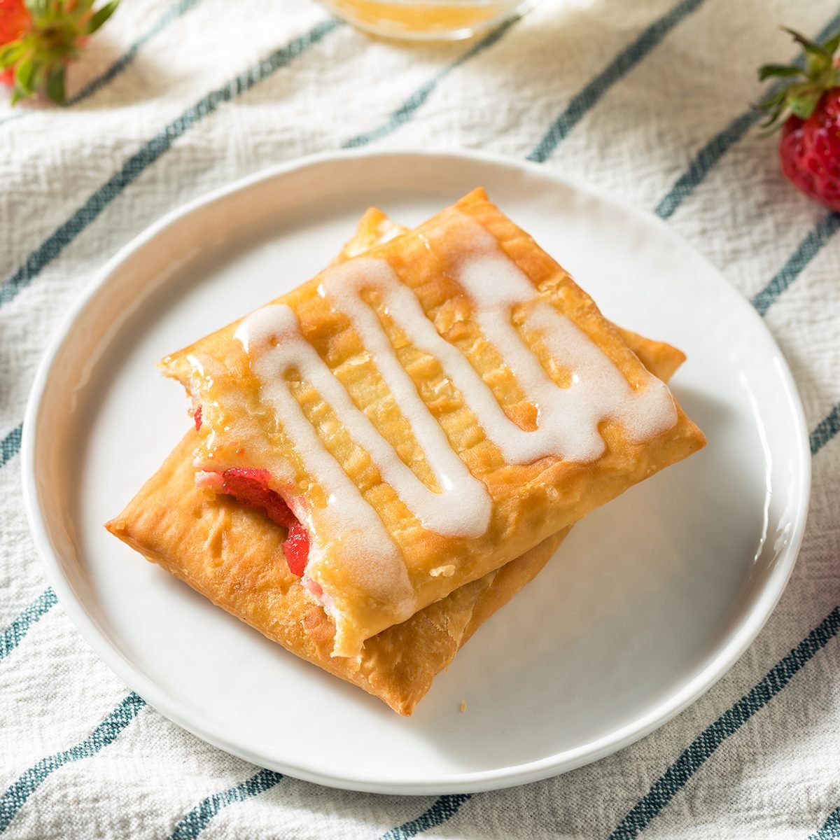 https://www.tasteofhome.com/wp-content/uploads/2019/11/sweet-breakfast-strawberry-toaster-pastry-frosting-shutterstock_1381751501.jpg