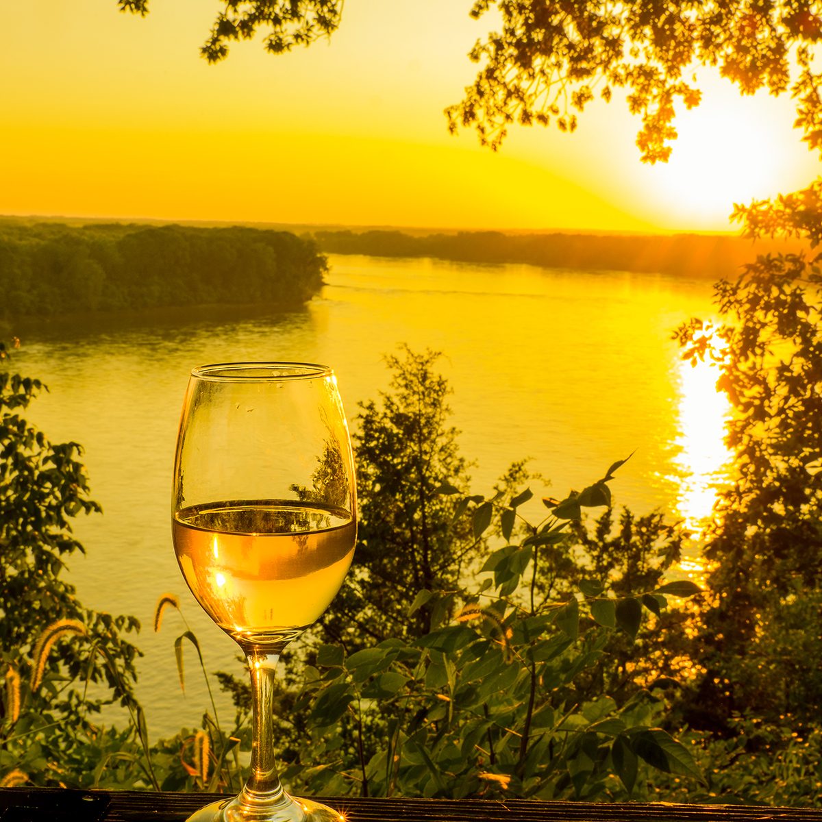 Beautiful view of glass of wine at sunset