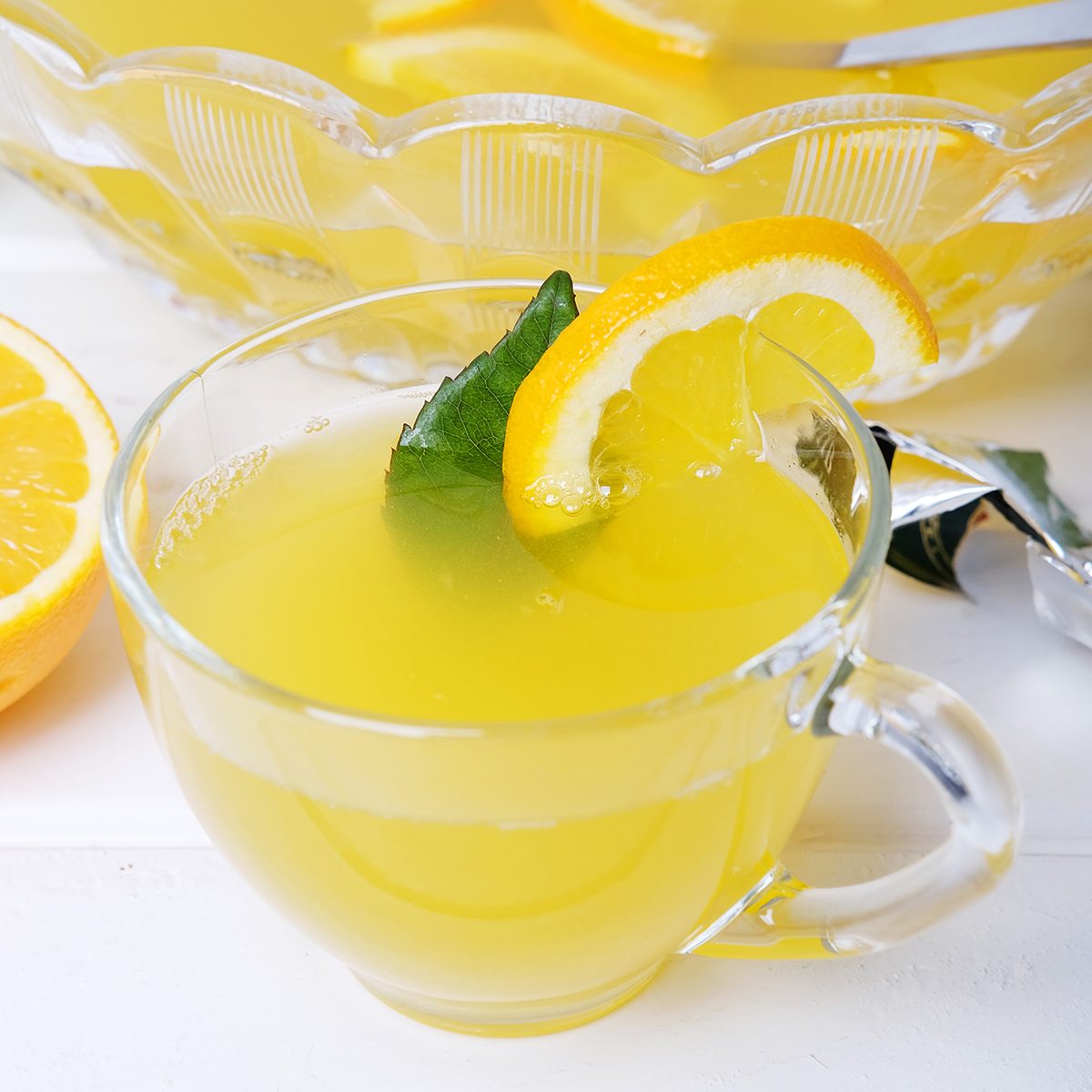 Lemon punch with pieces of fruit sweet alcohol summer drink