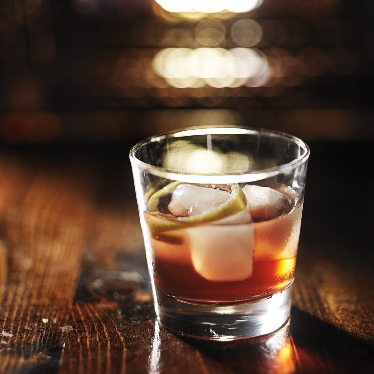 sazerac cocktail on dark wooden background