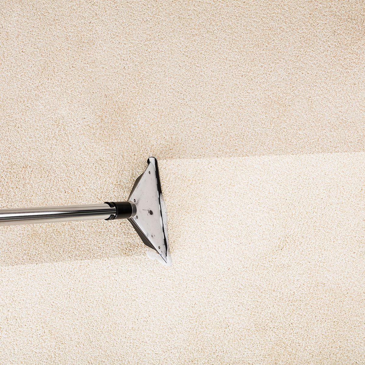 Close-up Photo Of Vacuum Cleaner With Carpet