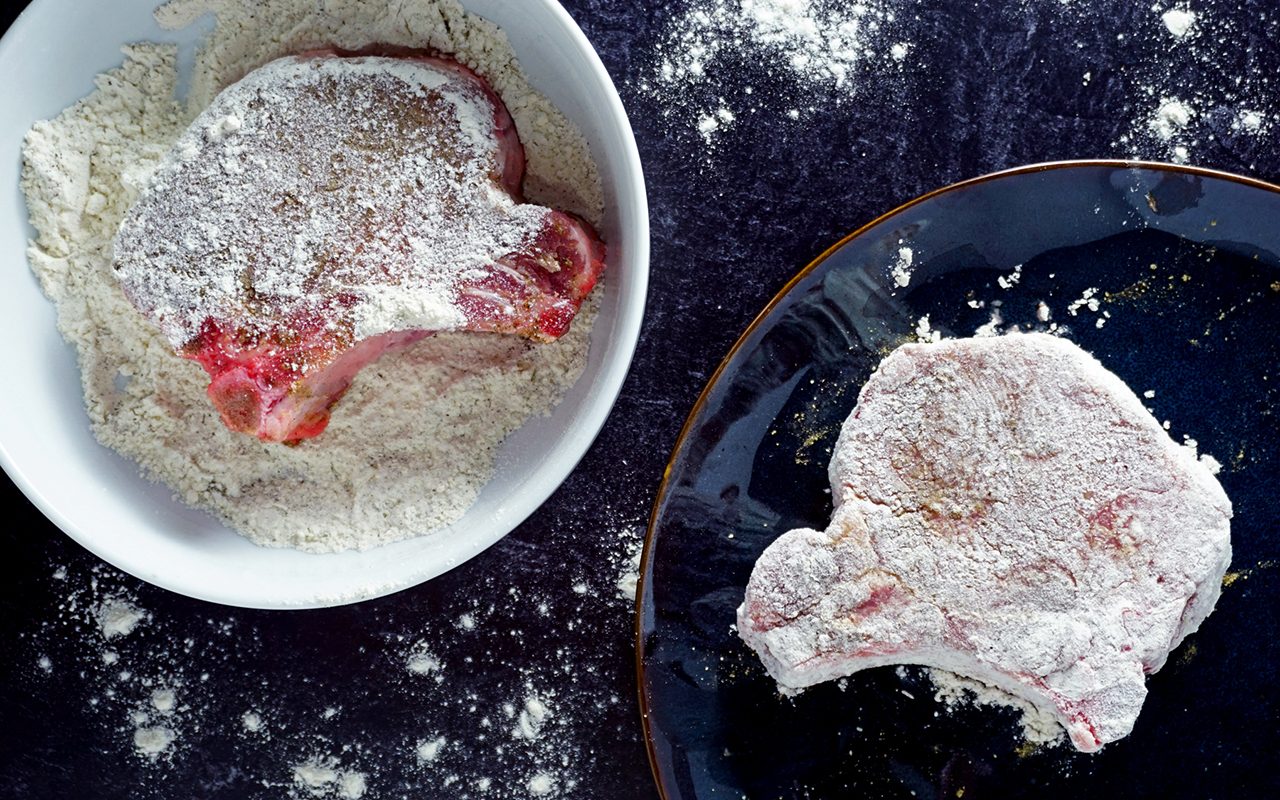 dredging pork chops in flour