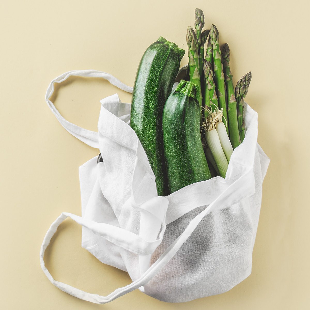 Zero waste concept. Vegetables in textile bag. No plastic. Bright Background. Clever consuming, healthy planet concept.