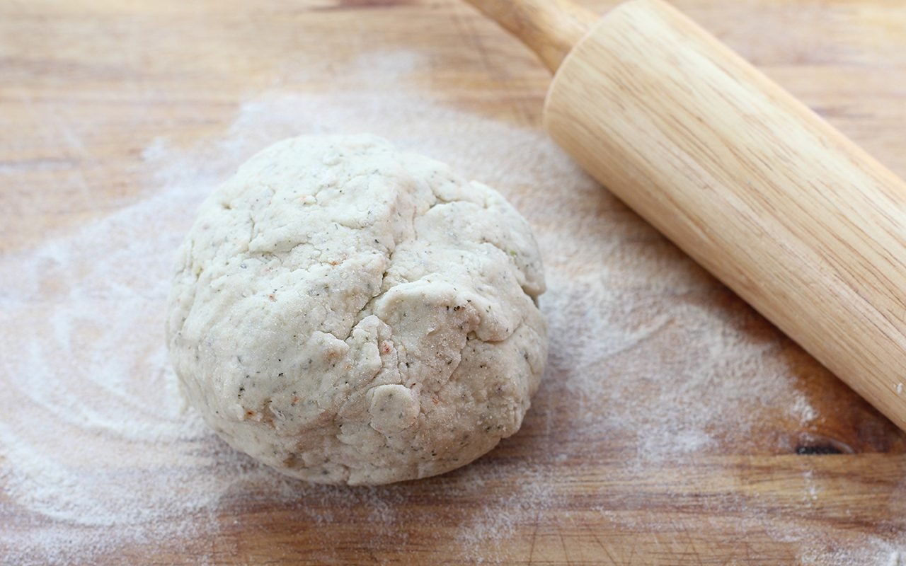 Preparing to roll out the dough on a floured surface