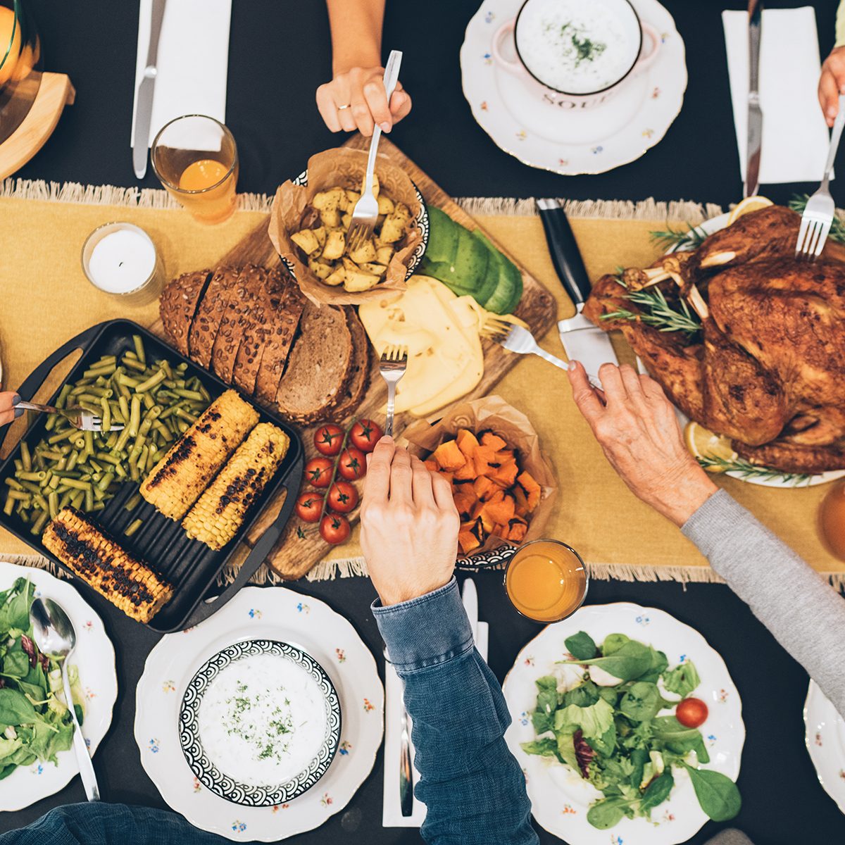 Overhead view of big family eating from table during Christmas dinner