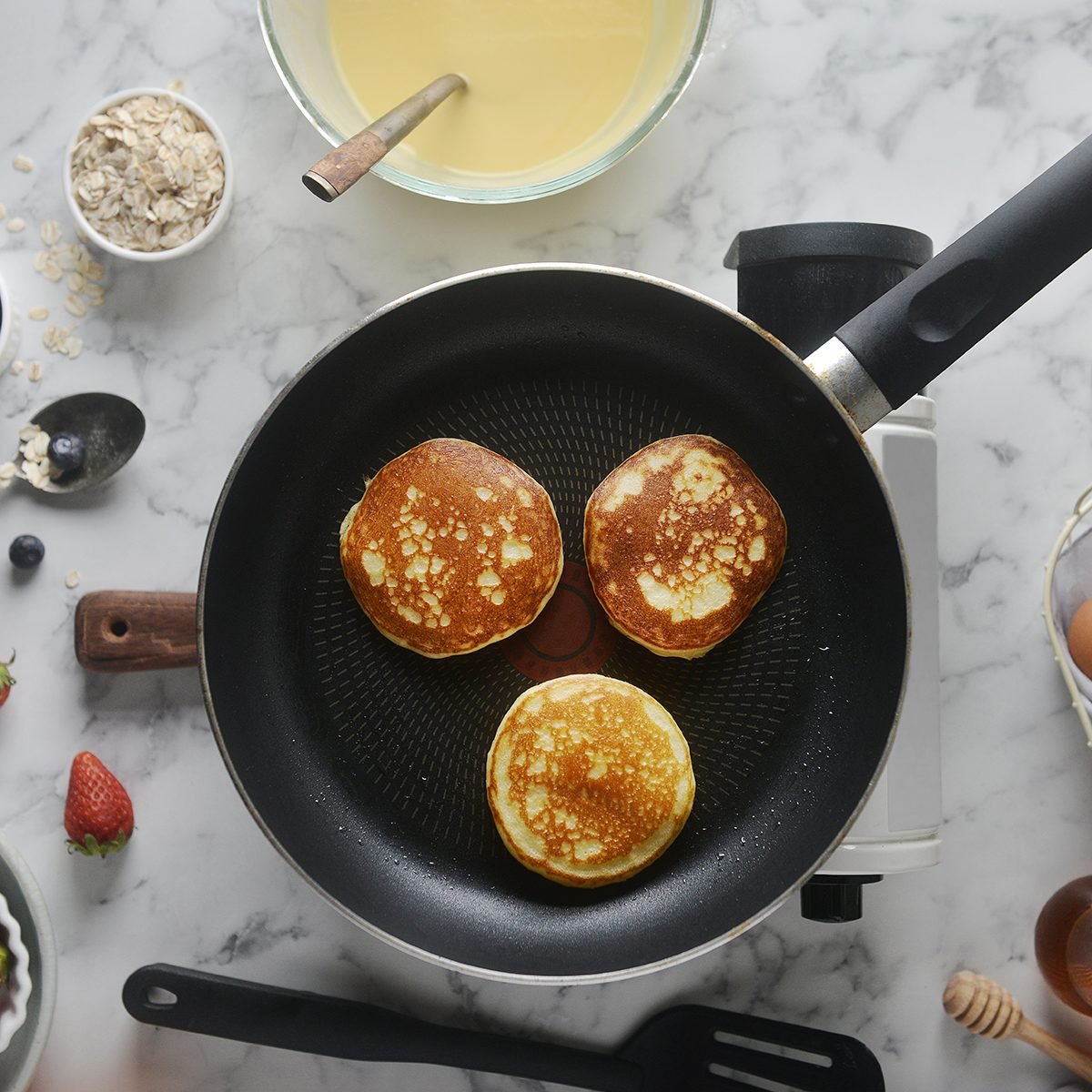 https://www.tasteofhome.com/wp-content/uploads/2020/02/pancakes-onto-the-pan-concept-of-cooking-GettyImages-1148827579.jpg?fit=700%2C700