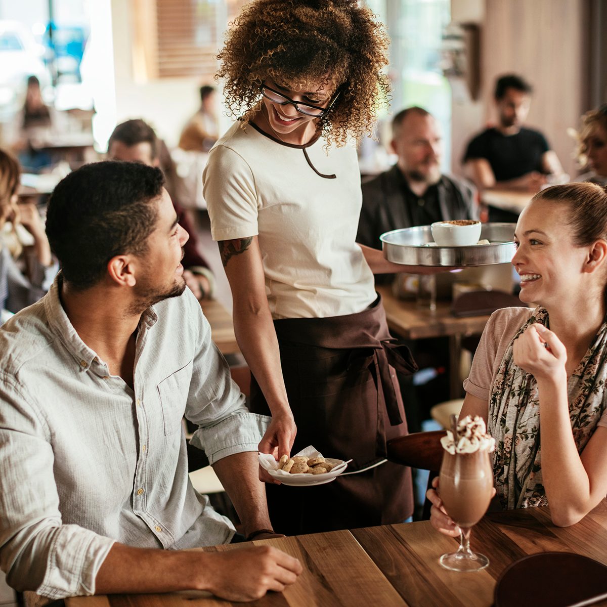 Close up of a couple ordering drinks