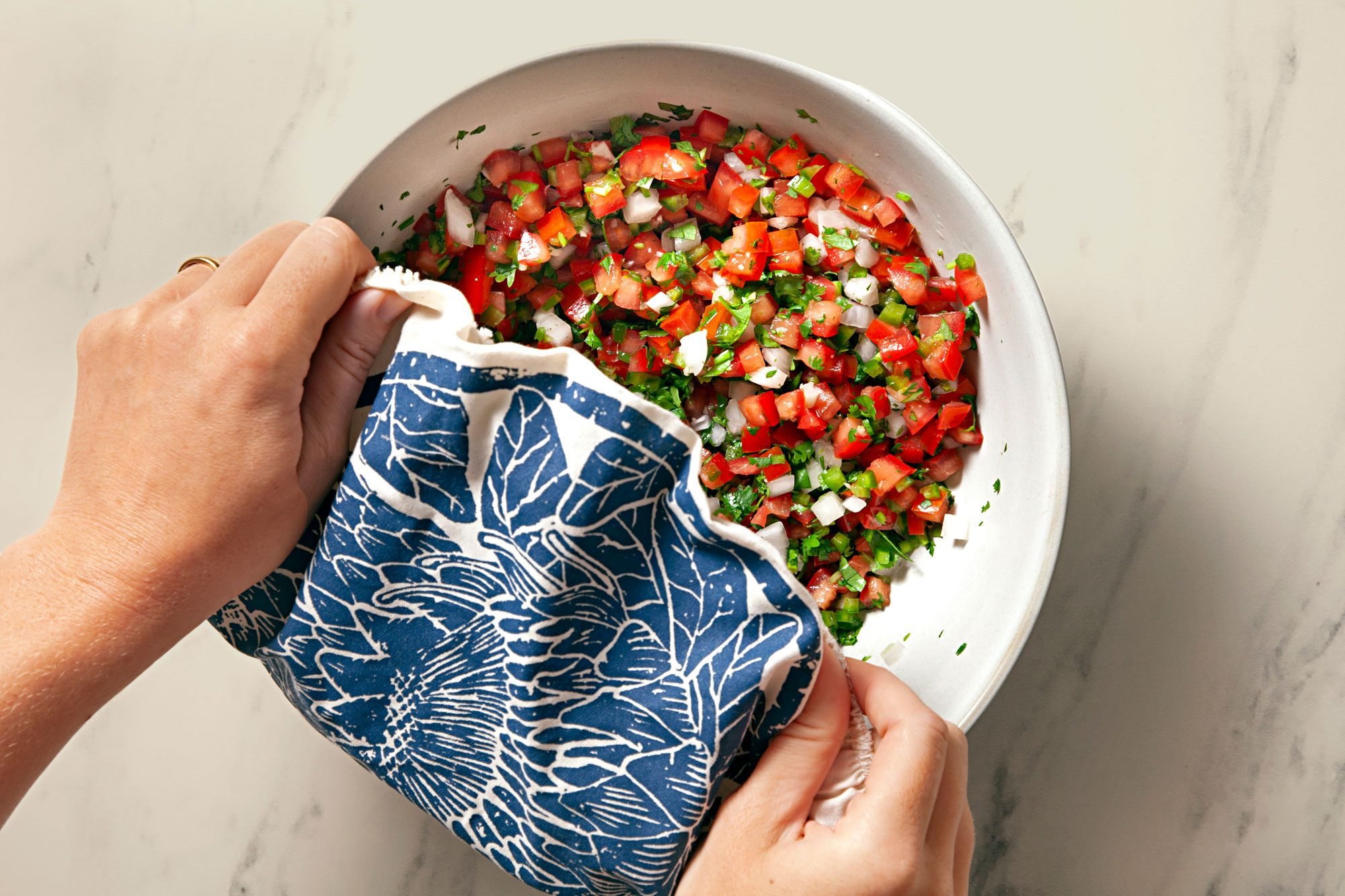 Overhead shot of same bowl; cover and refrigerate for 1-2 hours before servings; marble background;