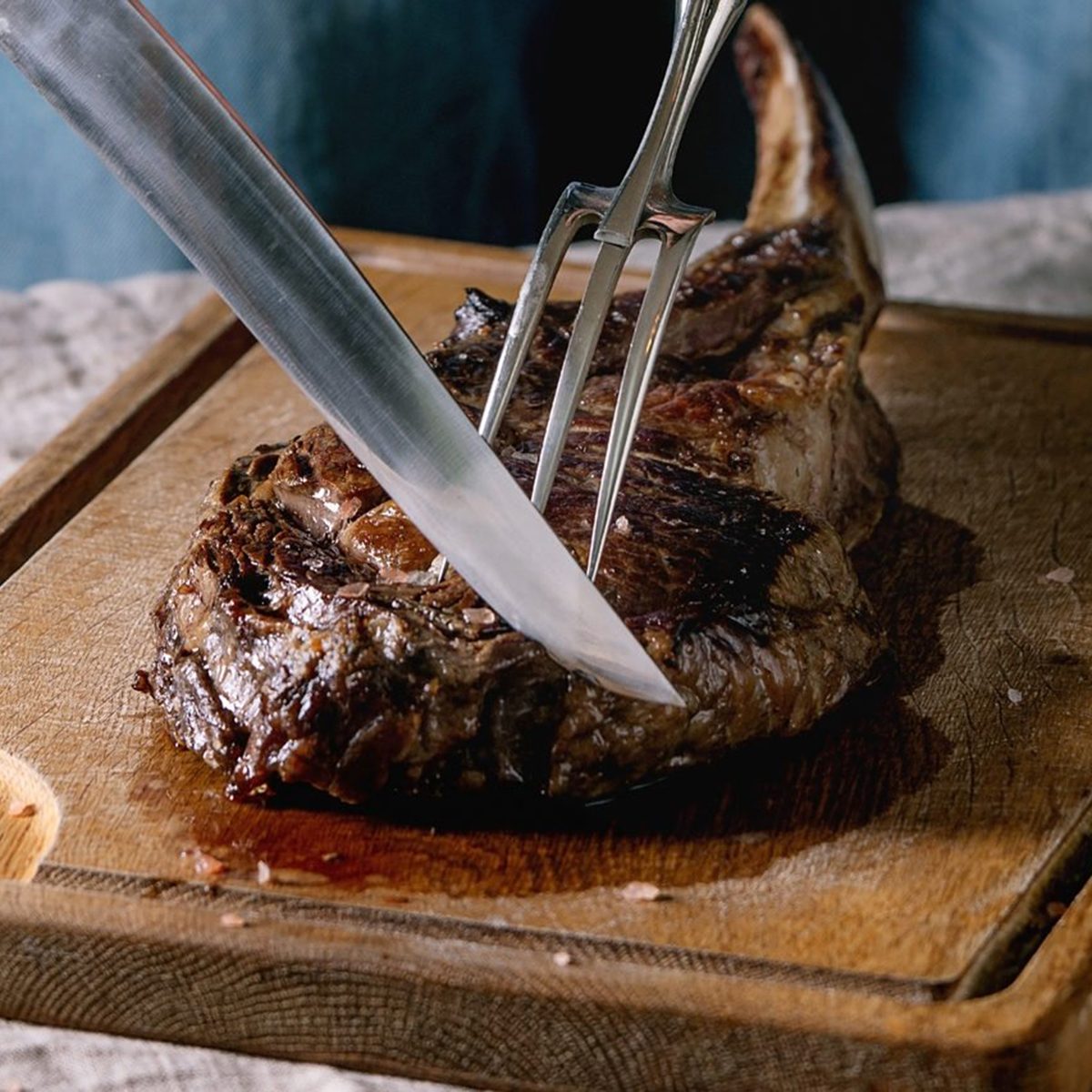 Slicing into grilled meat