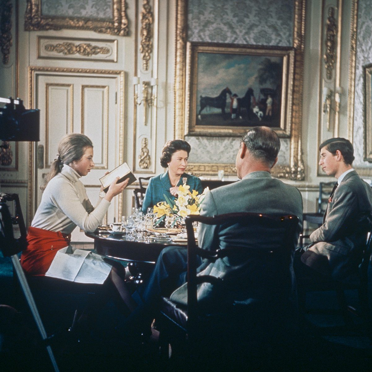 Royal family sitting at a table