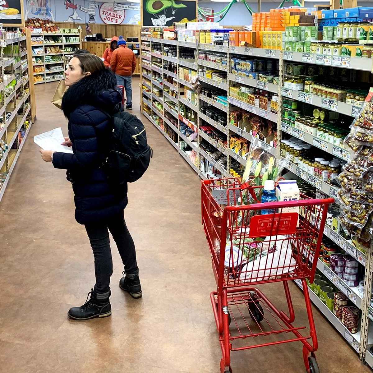 CAMBRIDGE, MASSACHUSETTS - MARCH 23: A woman shops at Trader Joe's at on March 23, 2020 in Cambridge, Massachusetts. The store has begun limiting the capacity of shoppers allowed inside, and offering sanitizing wipes upon entry. Massachusetts. The store has begun limiting the number of shoppers allowed inside and offering sanitizing wipes upon entry. Massachusetts Gov. Charlie Baker ordered all nonessential businesses closed by noon on March 24 in an attempt to slow the spread of COVID-19. Grocery stores and pharmacies will remain open, with restaurants limited to offering take-out service. (Photo by Maddie Meyer/Getty Images)