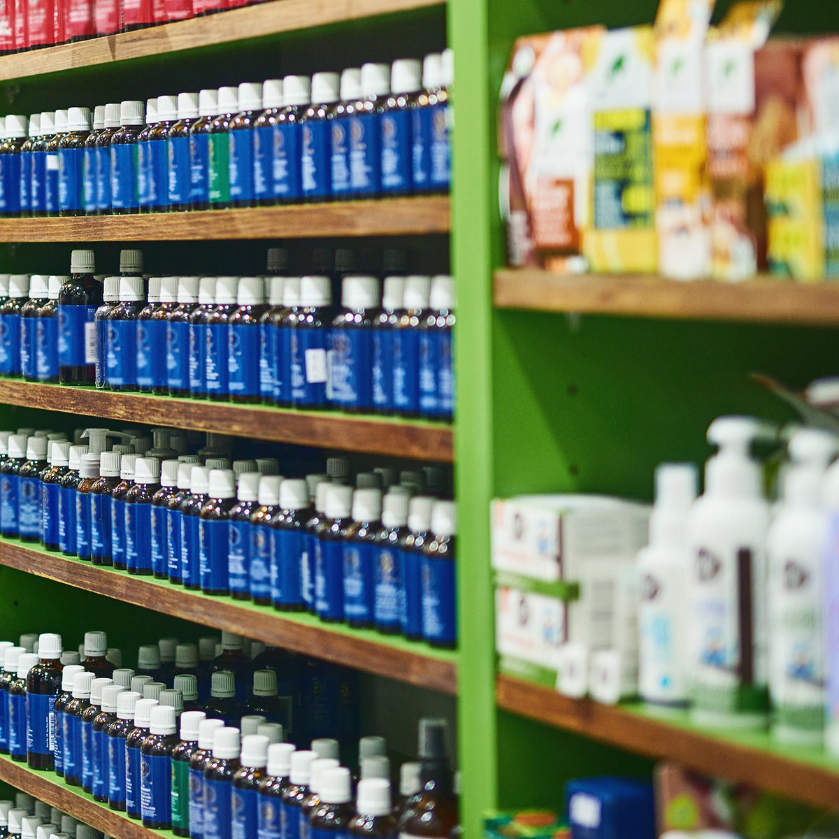 Shot of a confident man using a digital tablet while working in a health store