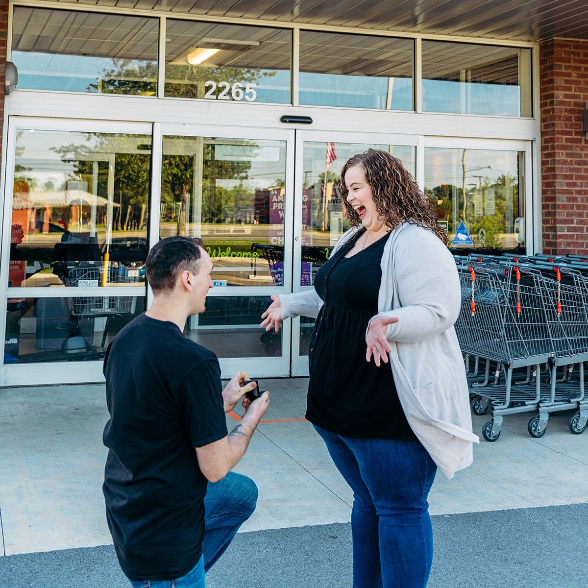 Patrick proposing in front of Aldi store