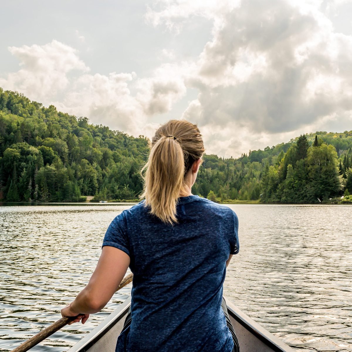 Woman rowing a kayak