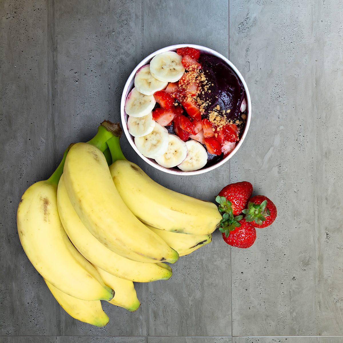 Acai Bowl With Fruits Salad Banana Mango Kiwi and Strawberry, Delicious Açaí Brazilian Cream Dessert, Açai na Tigela with copy space