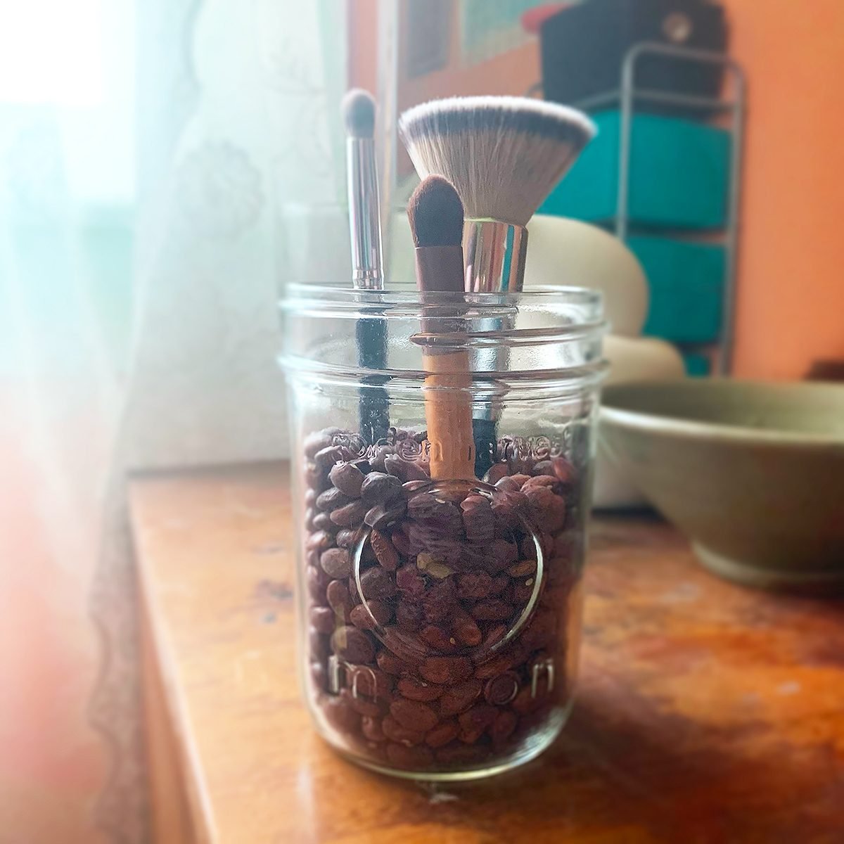 Dried beans as makeup brush holder