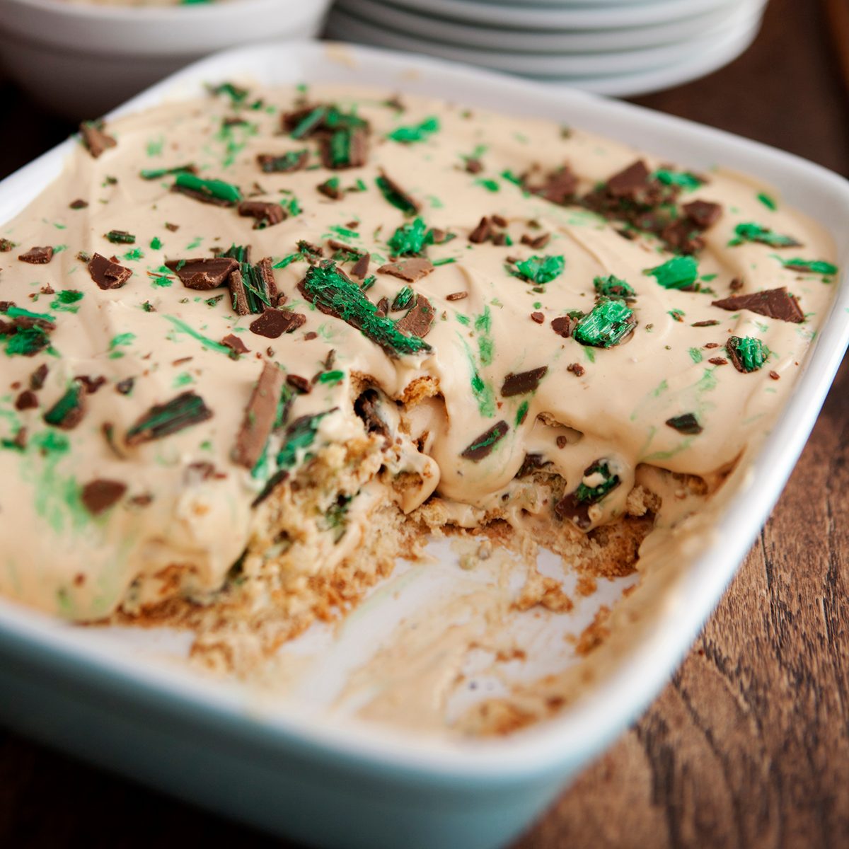 A traditional South African dessert tart made on a base of crushed biscuits, and the topping consists of condensed milk, cream, caramel and peppermint crisp chocolate. Decadently sweet and delicious!