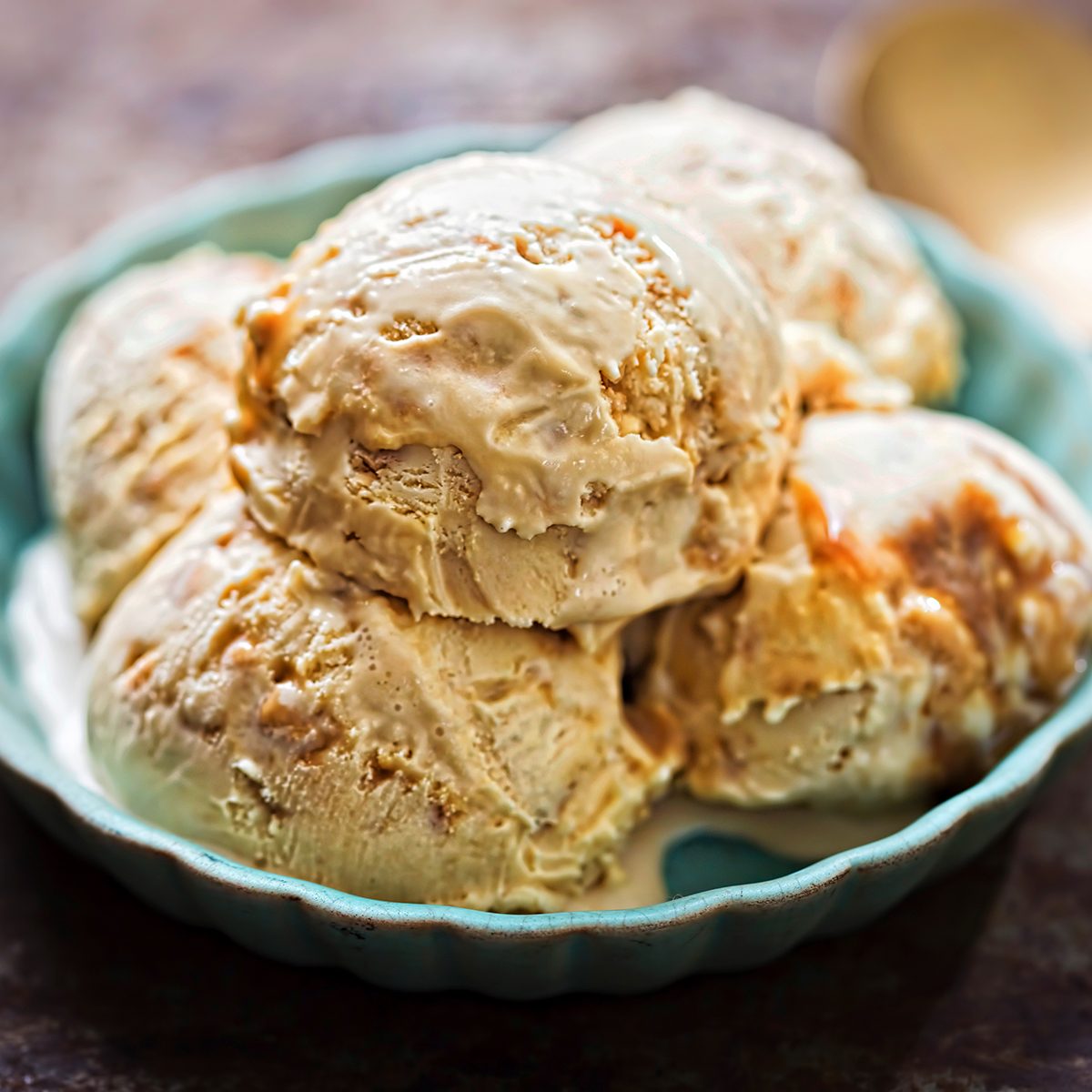 Salted caramel ice creams on blue plate