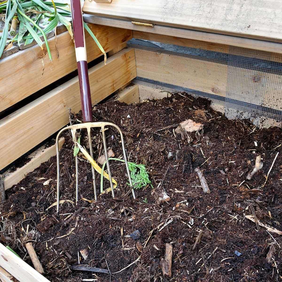 pitch fork in compost pile