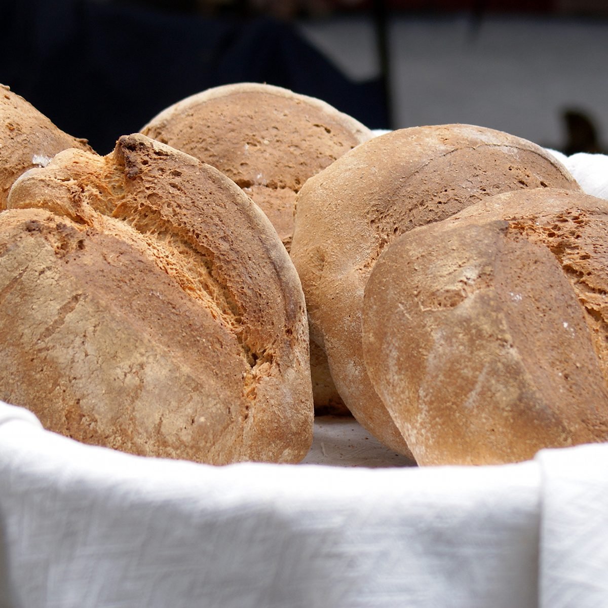 details of a basket with bread in a local market in Florence.