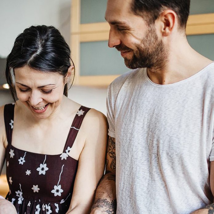 Mature Couple Preparing Food For Dinner