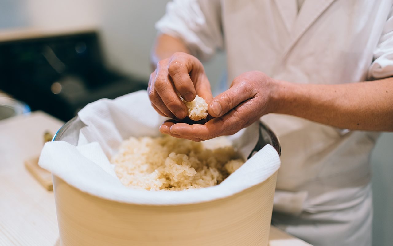 https://www.tasteofhome.com/wp-content/uploads/2021/02/sushi-chef-making-artisanal-nigiri-zushi-at-bar-639839968.jpg