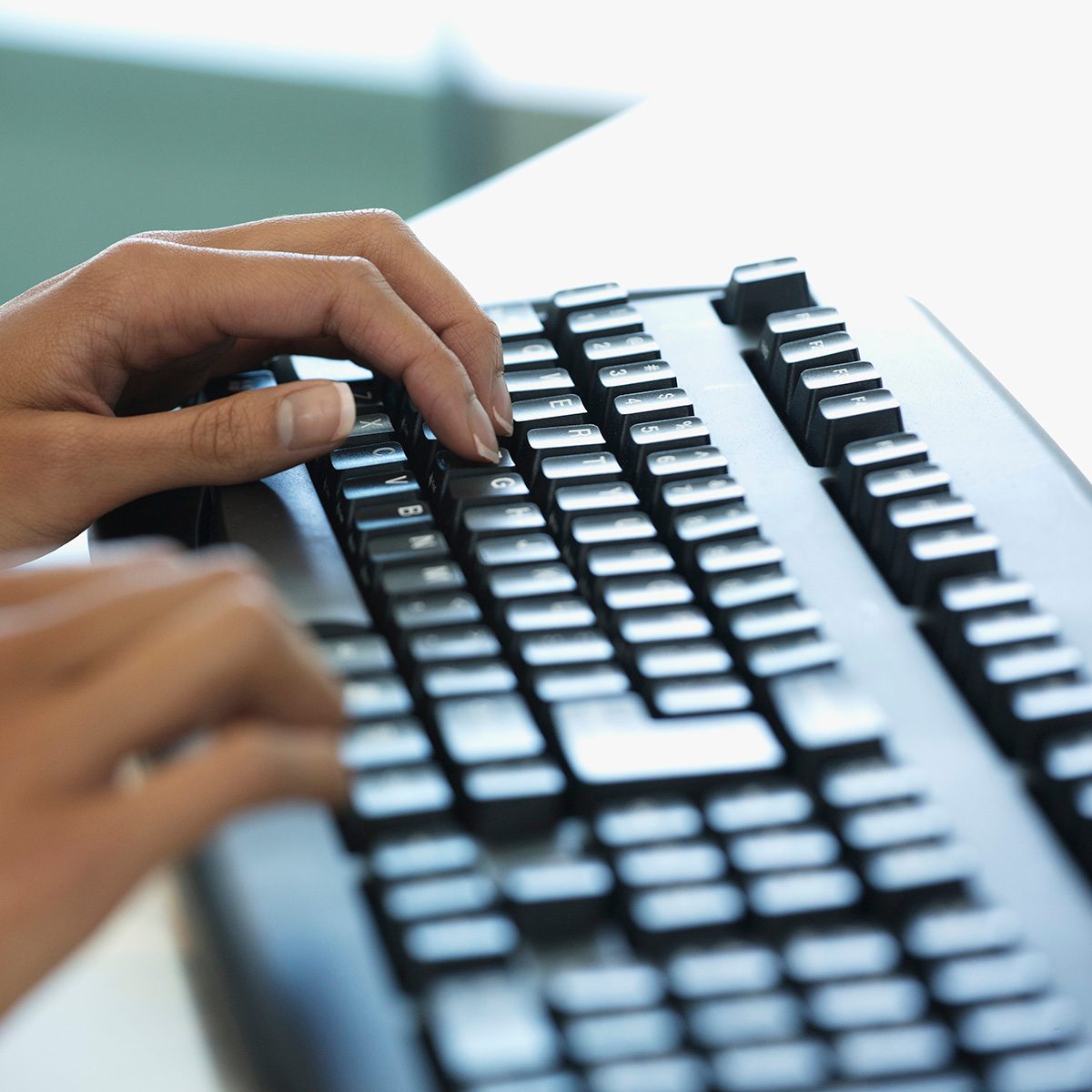 Hands On Keyboard In Modern Office Space