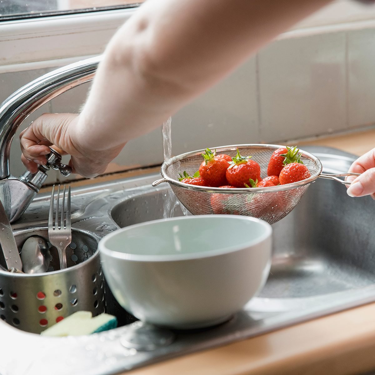 how to wash berries Rinsing Off The Strawberries