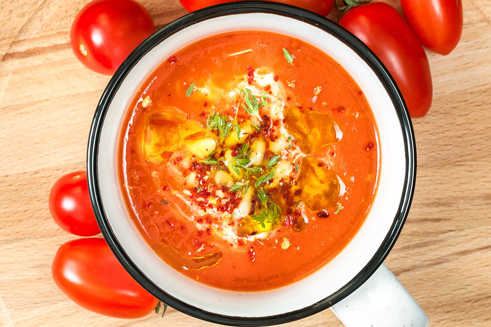 https://www.tasteofhome.com/wp-content/uploads/2021/10/Tomato-Soup-and-Tomatos-on-Wooden-Surface-GettyImages-485478744_KSedit.jpg?fit=700%2C467