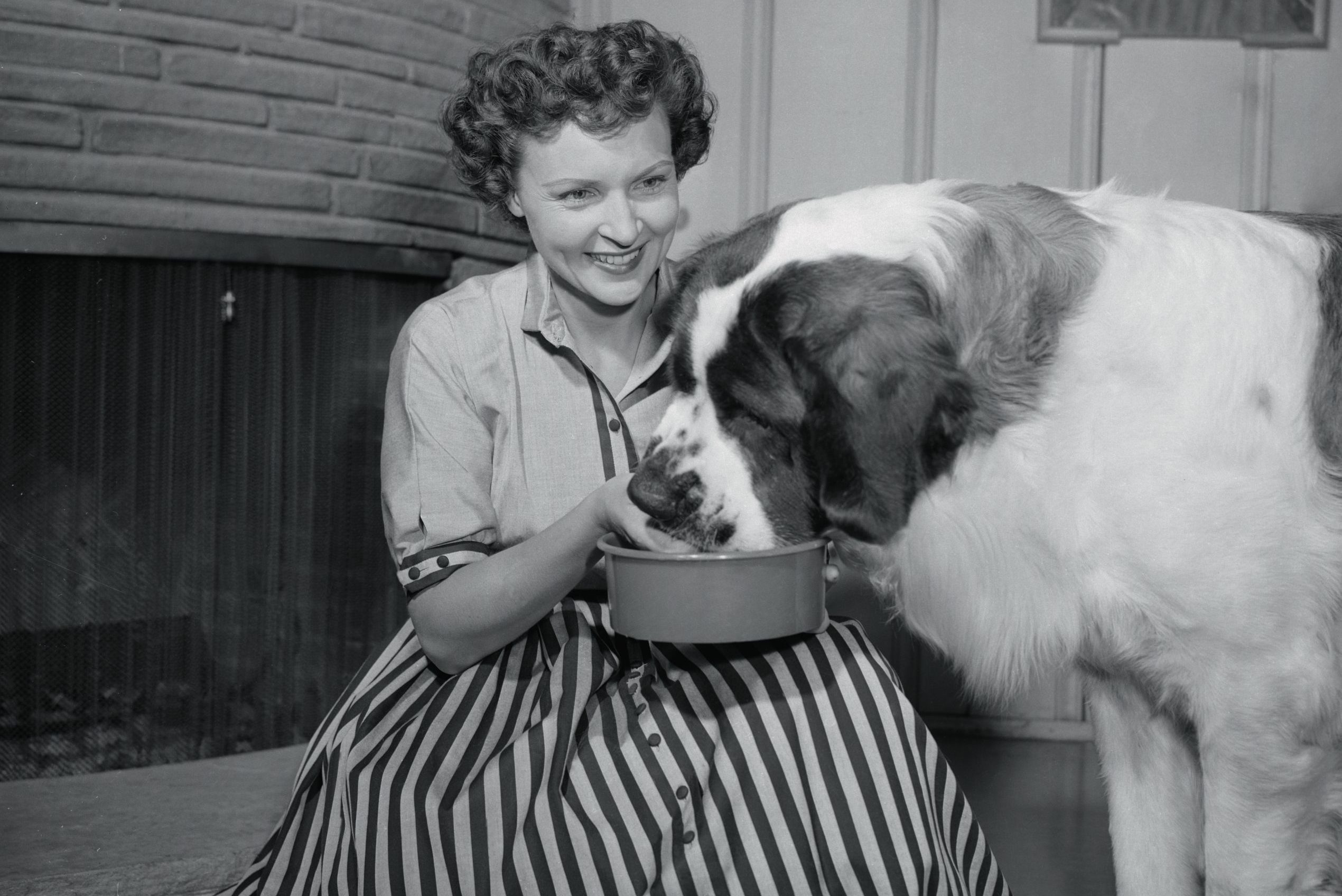 Betty White Feeding Her Dog