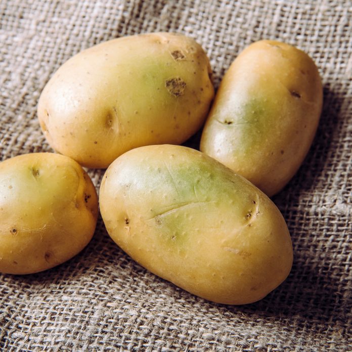 Sunlight and warmth turn potatoes skin green witch contain high levels of a toxin, solanine which can cause sickness and is poisonous. Do not buy and eat green potatoes! Heap on sackcloth.